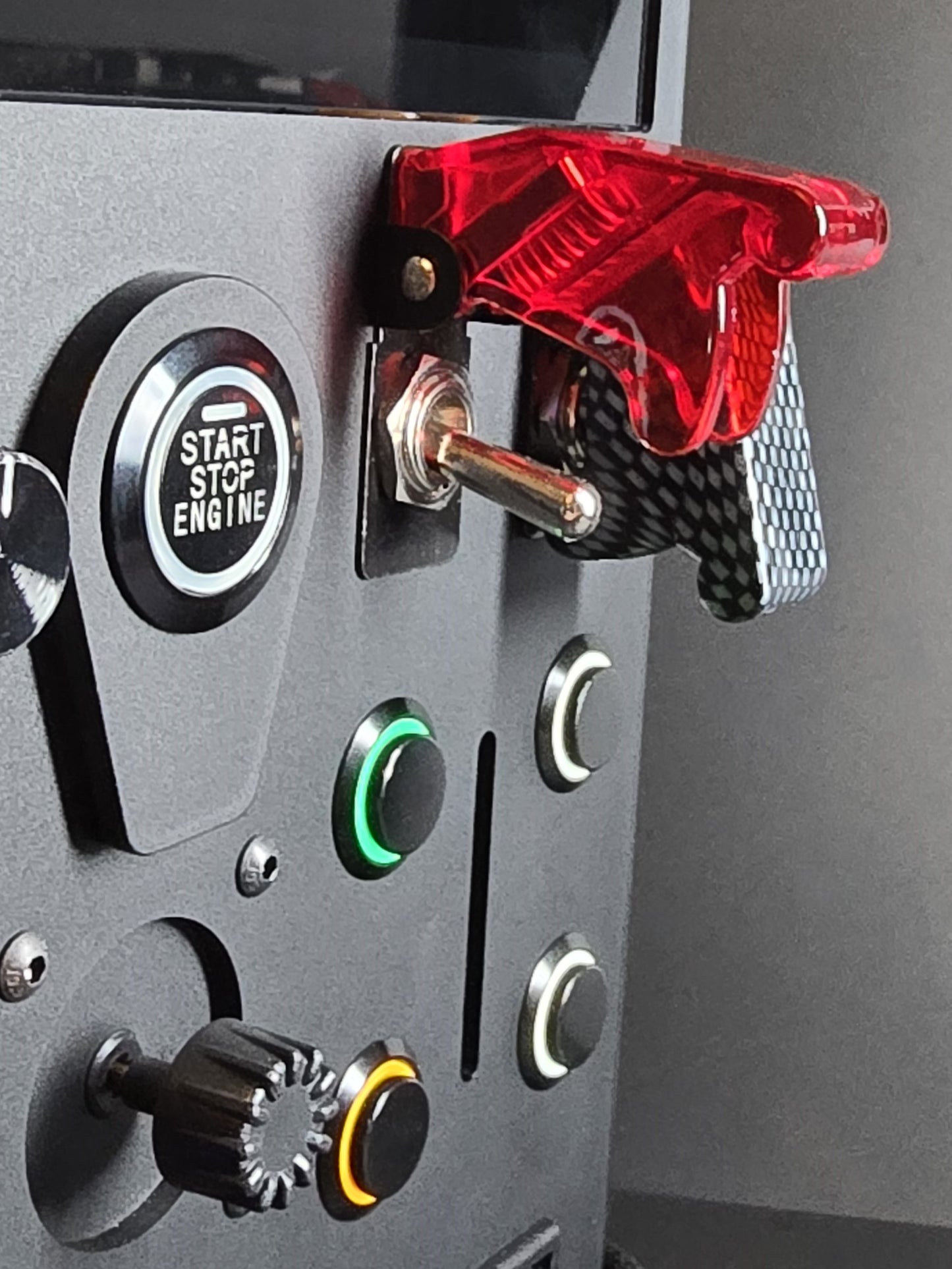 Close up shot of heavy duty toggle switches on a sim racing button box