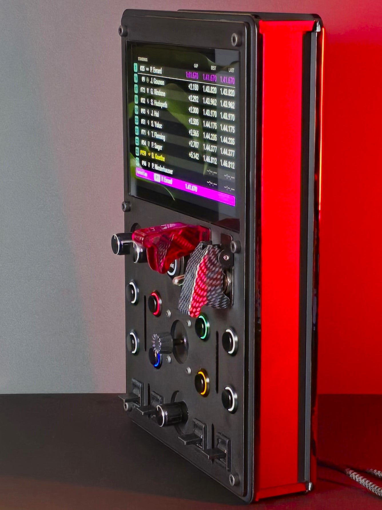 Side shot of a slim sim racing button box with a vocore 6.8" display