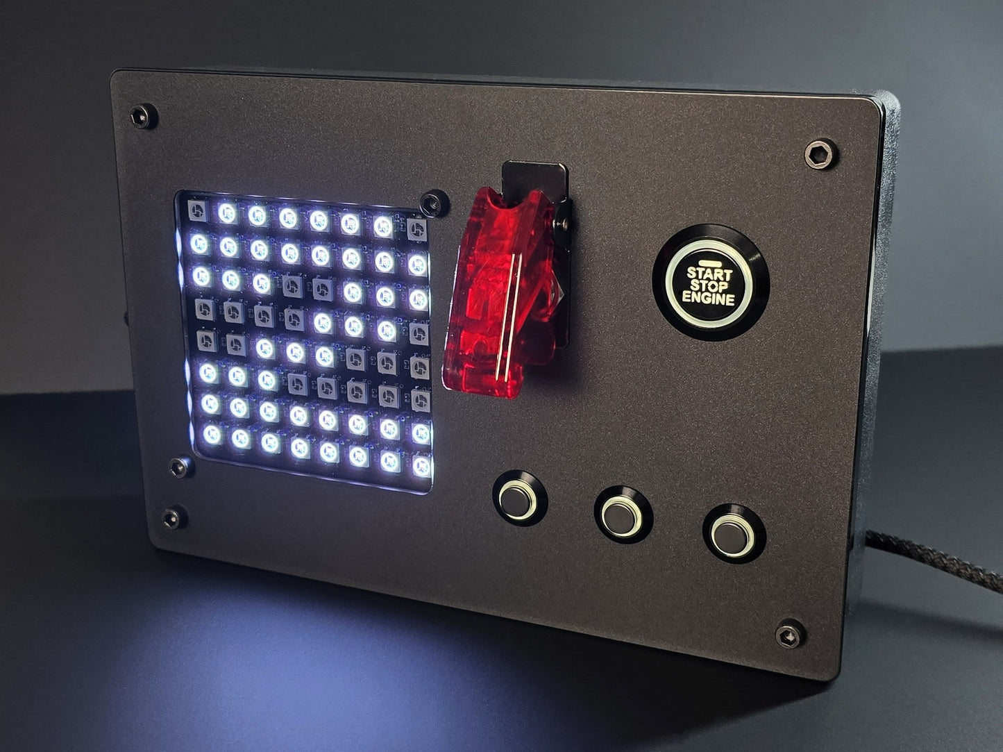 front shot of a sim racing button box with integrated iflag RGB matrix display