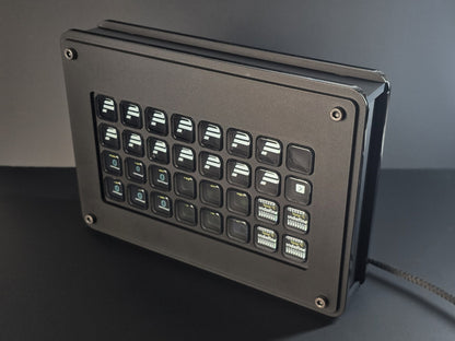 A stream deck enclosure designed for sim racing rigs